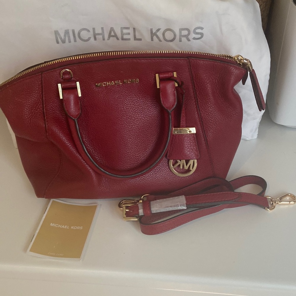 Michel kors red pocket book with dust bag